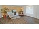 Cozy living room with accent wall, comfortable chairs, and natural light at 1673 Woodmoor Dr, Monument, CO 80132