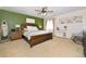 Comfortable main bedroom with a king bed, calming decor, and lots of natural light at 1673 Woodmoor Dr, Monument, CO 80132