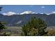Breathtaking mountain view with snow-capped peaks and lush green landscape at 1673 Woodmoor Dr, Monument, CO 80132