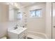 Bright bathroom with a single sink vanity and a shower-tub combo, offering a clean and functional space at 3205 Moorhead Ave, Boulder, CO 80305