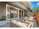 Cozy backyard patio with modern outdoor seating and sliding glass doors at 3770 Osceola St, Denver, CO 80212