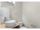 Half bathroom features modern vessel sink, faucet, toilet, lighting and mirror at 3770 Osceola St, Denver, CO 80212