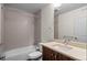 A clean bathroom featuring a tub, shower, and sink vanity with modern fixtures at 3770 Osceola St, Denver, CO 80212