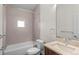 Clean bathroom featuring a tub, shower, and sink vanity with modern fixtures at 3770 Osceola St, Denver, CO 80212