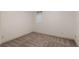 An empty bedroom with neutral carpet and small window at 3770 Osceola St, Denver, CO 80212