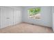 Bright bedroom with natural light, large window with a view, and double door closet for ample storage at 3770 Osceola St, Denver, CO 80212
