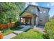 Charming two-story home boasting a covered front porch, neat landscaping and stone detail at 3770 Osceola St, Denver, CO 80212