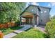 Charming two-story home boasting a covered front porch, neat landscaping and stone detail at 3770 Osceola St, Denver, CO 80212