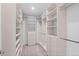 Spacious walk-in closet with custom shelving and drawers offers ample storage at 3770 Osceola St, Denver, CO 80212