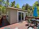 Exterior deck for outdoor dining with table, chairs, and sun umbrella at 11650 Baca Rd, Conifer, CO 80433