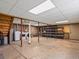 Unfinished basement with open space ready for customization with washer and dryer hookups at 11650 Baca Rd, Conifer, CO 80433