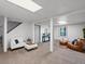 Spacious basement living area with cozy seating and natural light from a window at 11650 Baca Rd, Conifer, CO 80433