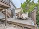 Cozy backyard deck featuring wood construction, steps, and space for outdoor dining under a protective cover at 745 Stowe St, Highlands Ranch, CO 80126