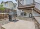 The backyard features a spacious deck with stairs, a grill, and low-maintenance landscaping at 745 Stowe St, Highlands Ranch, CO 80126