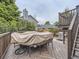 Home backyard features a spacious wooden deck covered for protection, perfect for outdoor dining and grilling at 745 Stowe St, Highlands Ranch, CO 80126
