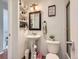 A well-organized bathroom featuring a pedestal sink and a shower at 745 Stowe St, Highlands Ranch, CO 80126
