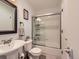 A clean and bright bathroom featuring a shower with glass doors at 745 Stowe St, Highlands Ranch, CO 80126