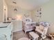 Charming Bedroom with crib, glider, and changing table at 745 Stowe St, Highlands Ranch, CO 80126