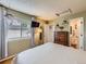 This is a cozy bedroom with a dresser, window and plant at 745 Stowe St, Highlands Ranch, CO 80126