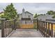 Home boasts a wooden deck with railings, providing a relaxing outdoor space and views of the surrounding neighborhood at 745 Stowe St, Highlands Ranch, CO 80126