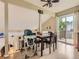 Open dining area with ceiling fan and access to a private outdoor deck at 745 Stowe St, Highlands Ranch, CO 80126