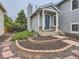 Charming two-story home with a welcoming front porch and landscaped garden at 745 Stowe St, Highlands Ranch, CO 80126
