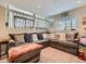 A cozy living room featuring a sectional sofa and lots of pillows at 745 Stowe St, Highlands Ranch, CO 80126