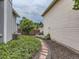 The side yard showcases lush greenery, a stone path, and manicured landscaping, enhancing the home's curb appeal at 745 Stowe St, Highlands Ranch, CO 80126