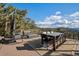 Stunning outdoor deck with patio furniture and gorgeous mountain views at 24798 Foothills N Dr, Golden, CO 80401