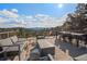 Outdoor deck and patio featuring comfortable seating and stunning mountain views at 24798 Foothills N Dr, Golden, CO 80401