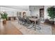 Spacious dining room with views into the entryway featuring a wooden accent wall at 24798 Foothills N Dr, Golden, CO 80401