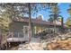 Exterior of house and deck in wooded area at 24798 Foothills N Dr, Golden, CO 80401