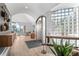 Warm foyer with hardwood floors, glass block window, and views to a seating area at 24798 Foothills N Dr, Golden, CO 80401