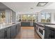 Beautiful kitchen with stainless steel appliances, countertops, and windows at 24798 Foothills N Dr, Golden, CO 80401