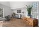 Cozy living area featuring hardwood floors, a dining table, and decorative furniture at 24798 Foothills N Dr, Golden, CO 80401