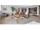 A cozy living room featuring a leather couch, glass-topped coffee table, and decorative accents at 24798 Foothills N Dr, Golden, CO 80401