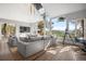 Open living area with hardwood floors, big windows, vaulted ceiling, and comfortable sofas at 24798 Foothills N Dr, Golden, CO 80401