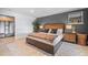 Comfortable bedroom with a large bed, stylish decor, and a view into an adjacent sitting area at 24798 Foothills N Dr, Golden, CO 80401