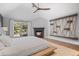 Spacious main bedroom featuring a fireplace and sliding doors to the outside at 24798 Foothills N Dr, Golden, CO 80401