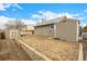 Backyard with shed, garden area, and wood retaining wall in a well-maintained outdoor space at 3170 S Princess Cir, Broomfield, CO 80020