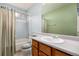 Bathroom featuring a vanity with a single sink, blue tile, and a bathtub at 3170 S Princess Cir, Broomfield, CO 80020