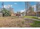 Backyard of home is large and shaded with grass and leafy ground cover at 10 Merideth Ln, Longmont, CO 80501