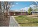 Brick home with well manicured lawn and ample space for outdoor enjoyment at 10 Merideth Ln, Longmont, CO 80501