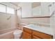 Bathroom with a combination tub and shower, updated vanity, and a classic design at 10 Merideth Ln, Longmont, CO 80501