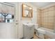 Bathroom with tile shower and updated vanity is clean and functional at 10 Merideth Ln, Longmont, CO 80501
