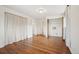 Bright bedroom features hardwood floors, closet, and easy access to the additional rooms at 10 Merideth Ln, Longmont, CO 80501