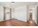 This bedroom has hardwood floors, a closet, neutral paint and en suite bath access at 10 Merideth Ln, Longmont, CO 80501