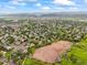 Expansive aerial view of the neighborhood with mountain views and lush green landscape at 5370 S Union Way, Littleton, CO 80127