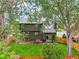 Green backyard featuring a spacious lawn, a patio with seating, and a privacy fence at 5370 S Union Way, Littleton, CO 80127
