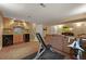 Finished basement with a wet bar with wine storage and a large seating area with a TV at 5370 S Union Way, Littleton, CO 80127
